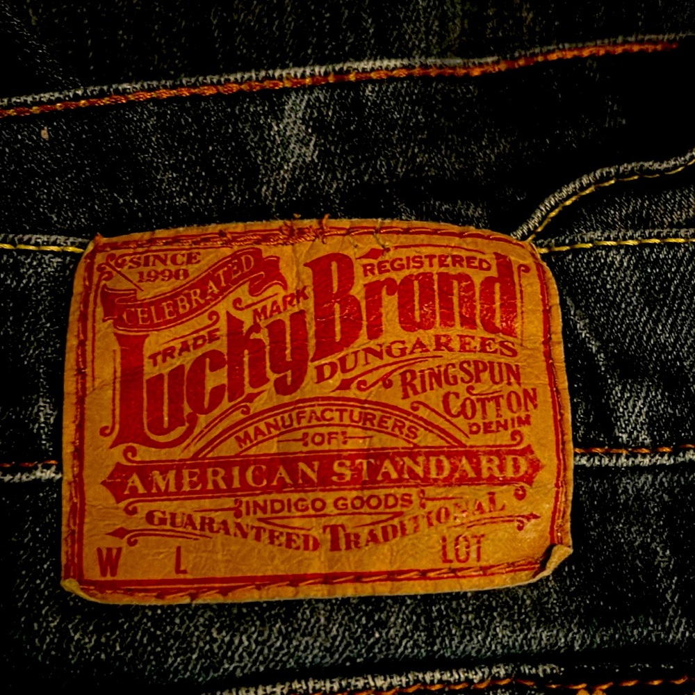 Lucky Jeans size 12 mid rise boot cut/ peace sign on back pocket